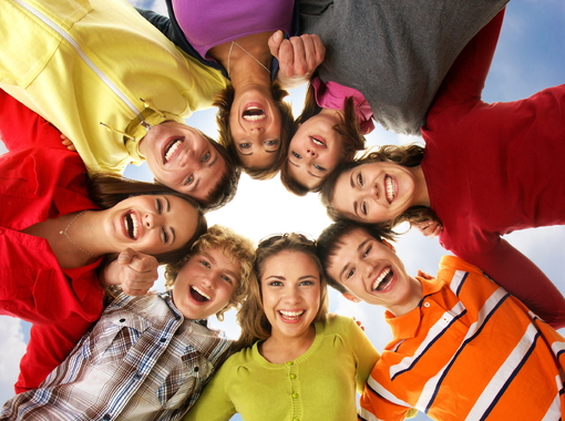 Teenagers on a light blue sky background